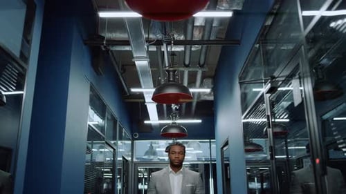 Friendly Afro Man Looking at Camera in Office. Businessman Waiting for Meetup