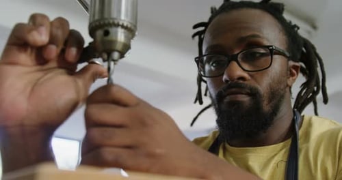 Carpenter adjusting drilling machine 4k