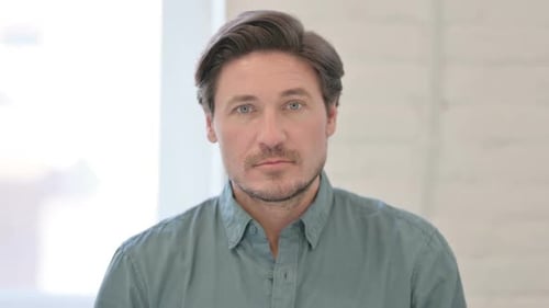 Man Raises Finger Shaking No In Studio