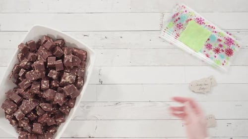 Flat lay. Step by step. Packaging homemade macadamia fudge into small gift bags