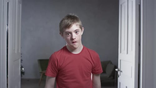 Boy in Red T-Shirt Standing in Doorway