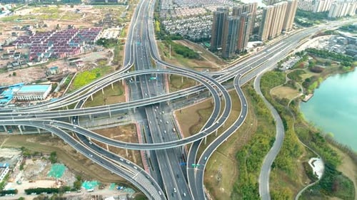 Top View to the Cars Driving on Multilevel Highway on the Sunset