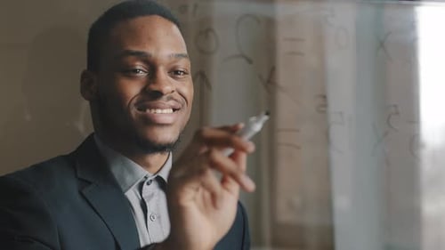 Alone Afroamerican Business Man Male Leader Standing on Modern Office Writing Ideas Formula Counting