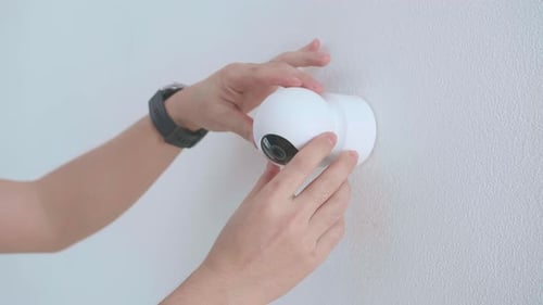 Installing Modern Security Camera on Wall with Drill