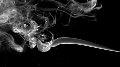 Abstract Smoke Plumes Against Black Background