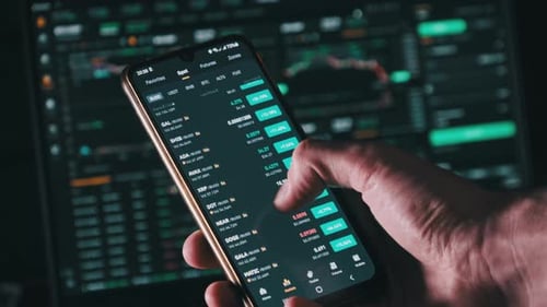 Hand Scrolling Through Finance Data on Smartphone