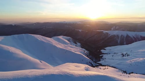 Snowy Mountains Landscape at Sunset