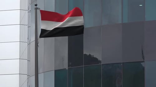 Realistic Waving Yemen Flag on Modern Building