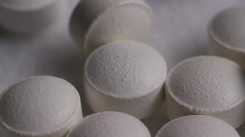 Round White Pills in Macro Close Up