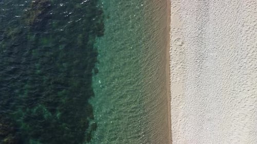 Aerial View on Calm Azure Sea and Volcanic Rocky Shores