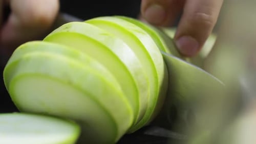 Slicing a Fresh Zucchini with a Sharp Knife