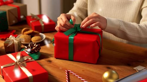 Wrapping Holiday Gift with Festive Ribbon and Decorations