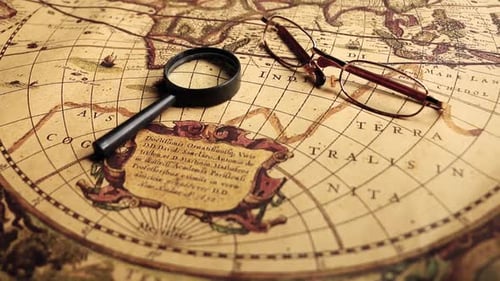 Antique World Map With Magnifying Glass and Glasses