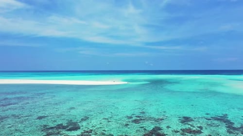 Aerial drone seascape of exotic shore beach time by blue sea and white sandy background of adventure