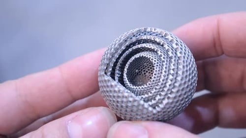 Small Geometric Ball Held in Hand