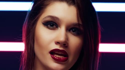 European Woman Singer Sings a Song in the Studio for a Music Video