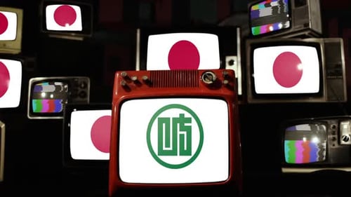 Old Televisions Displaying Static and Japanese Symbols