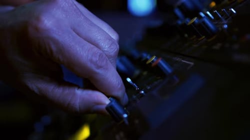 Sound engineer working at a mixing desk