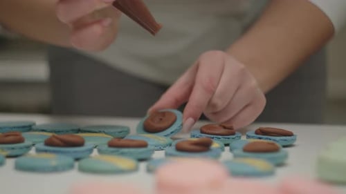 Decorating Macarons with Chocolate Frosting