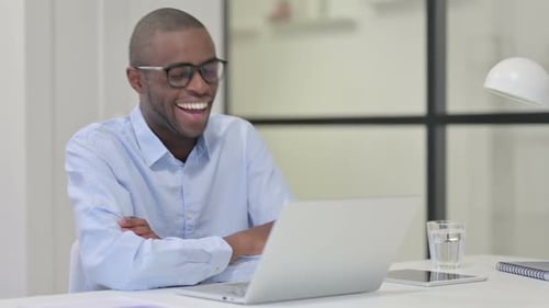 Man Engaging in a Video Call in Office
