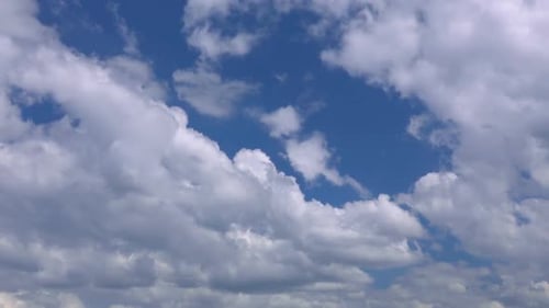 White Cumulus Clouds Against a Brilliant Blue Sky