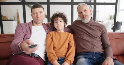 Relaxing with Family on Red Couch at Home