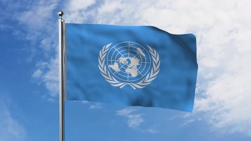 United Nations Flag Waving in Clear Blue Sky