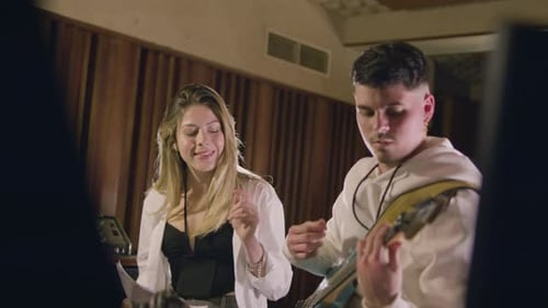 Two Musicians Working in Music Studio