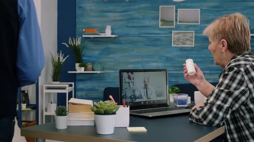 Senior Woman Talking with Doctor Via Video Call