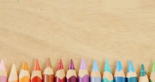 Close-up of colored pencil arranged in a row