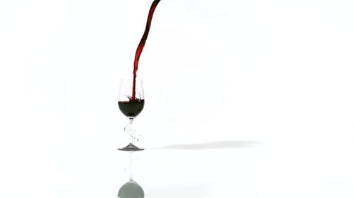 Pouring Red Wine into a Wine Glass