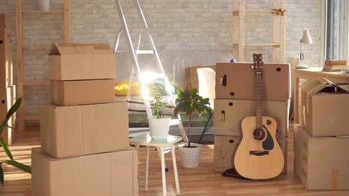 Boxes and Guitar in a Bright Sunny Room