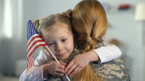 Soldier Mother Embraced by Daughter with American Flag