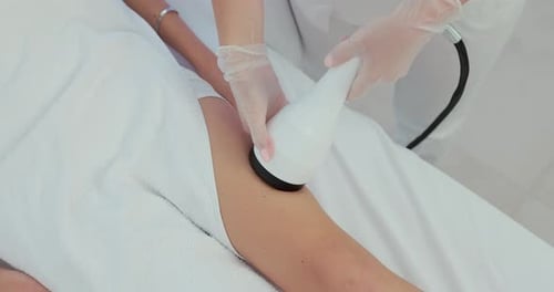 Leg Massage with Modern Device in Medical Office