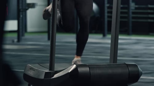 Person Running on Treadmill in Gym