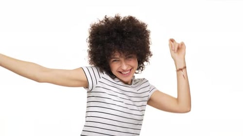 Happy Woman Dancing with Curly Hair on White Background