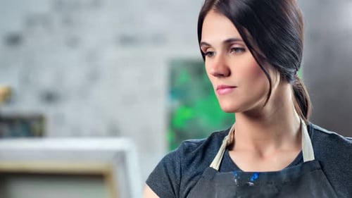 Tilt Up Female Painter Taking Color Paint From Palette Using Brush Enjoying Creating Picture