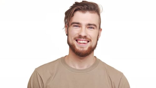 Man Smiling, Reacting, and Laughing at the Camera