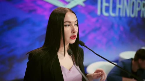 Woman Giving Presentation at Technology Conference