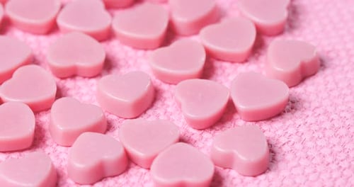 Light Pink Heart Shaped Candies on Pink Background