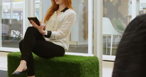 Female Executive Using Digital Tablet in Office 4k