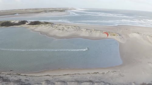 Arial view of a person doing windsurf in Retranchement, Netherlands.