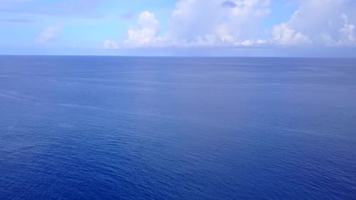 Aerial travel of coastline beach trip by blue water with sand background