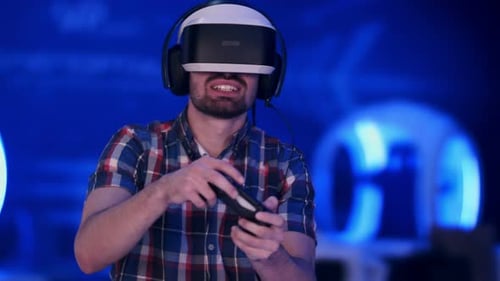 Man Immersed in Virtual Reality Gaming With Headset