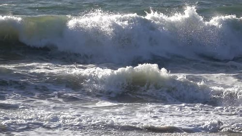 Waves Crashing on a Sunny Beach