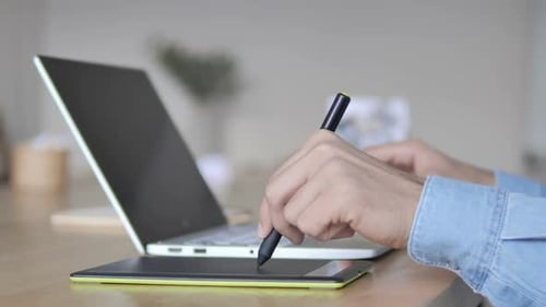 Graphic Designer Working With Design Tablet and Stylus