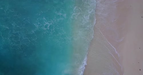 Daytime above island view of a white sandy paradise beach and blue ocean background in best quality