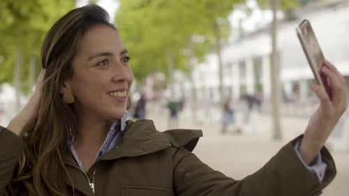 Woman Taking Selfie in Beautiful Park on Sunny Day