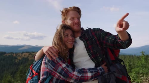 Happy Couple Hiking in the Mountains