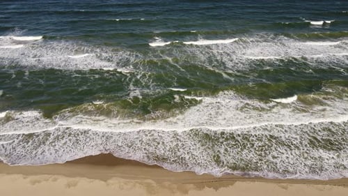 Aerial View of Sandy Beach and Sea Waves